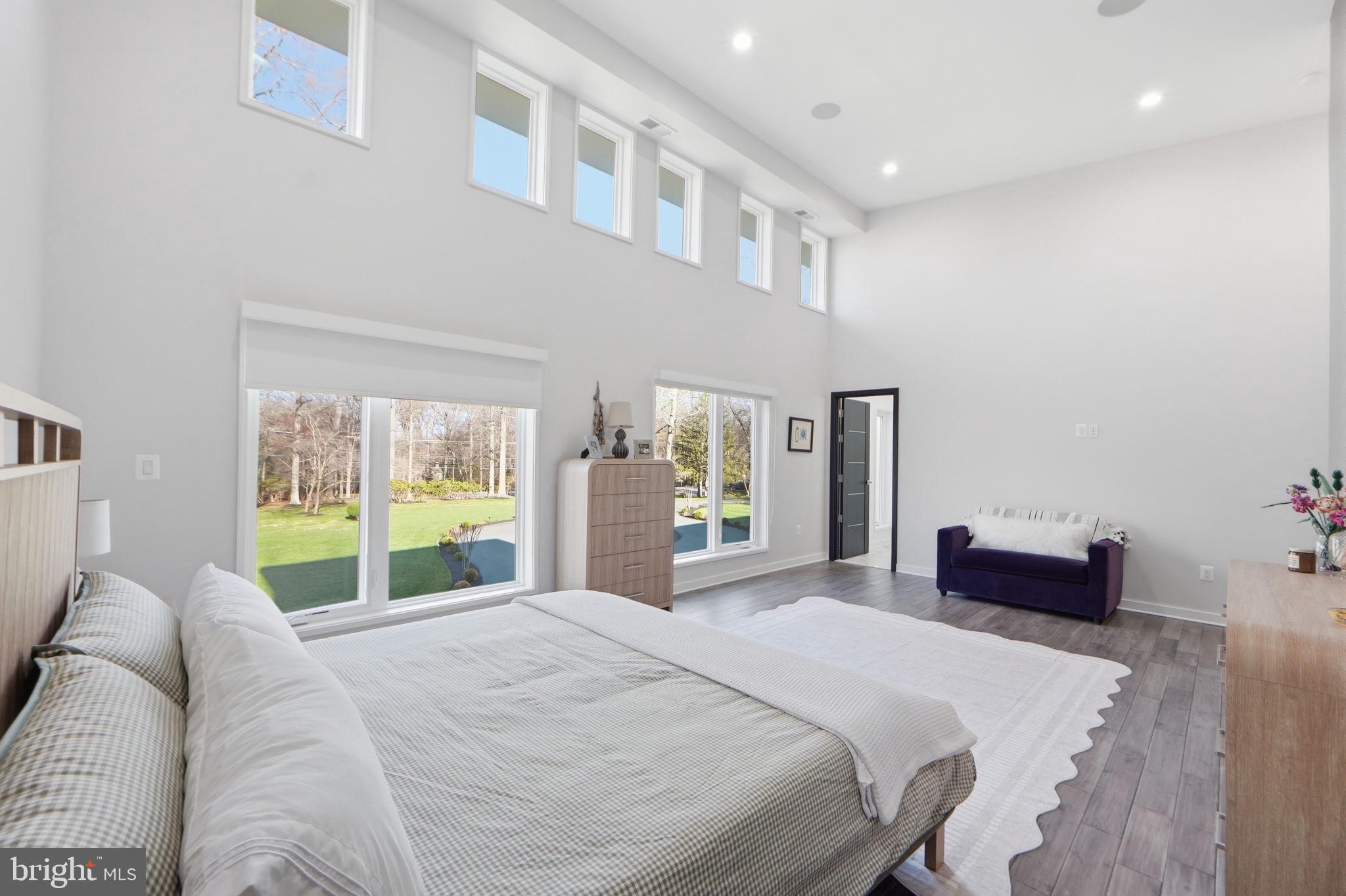2368 Hunter Mill Road Vienna, VA 22181 - Photo 68 of 74 a bedroom with a large bed and a large window