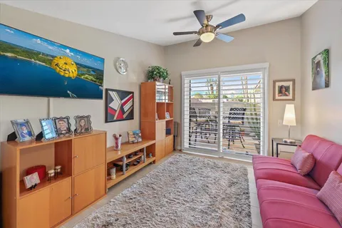 a view of house with patio outdoor seating and plants