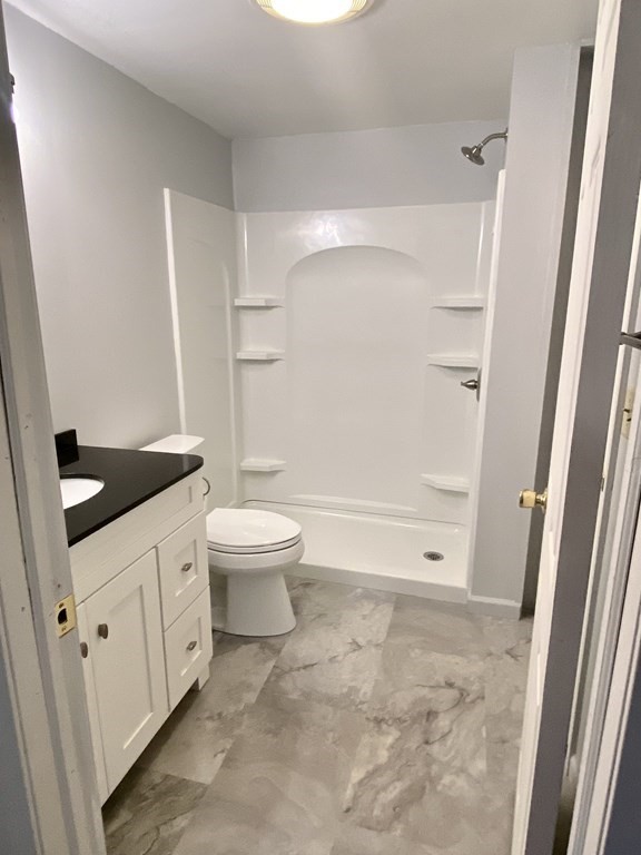 129 Greenwich Road Ware, MA 01082 - Photo 19 of 31 a bathroom with a granite countertop sink toilet and shower