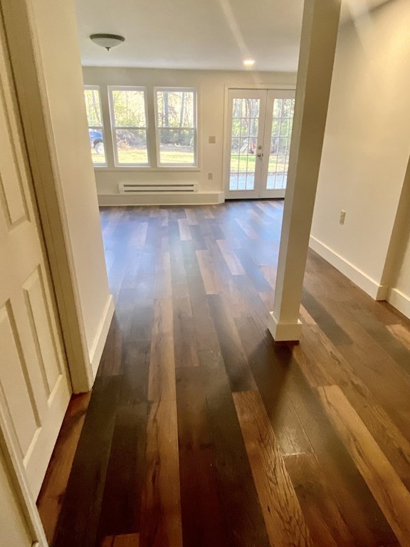 129 Greenwich Road Ware, MA 01082 - Photo 20 of 31 a view of an empty room with wooden floor and a window