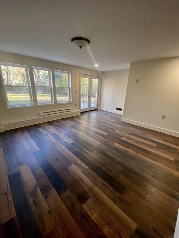 129 Greenwich Road Ware, MA 01082 - Photo 21 of 31 an empty room with wooden floor and windows