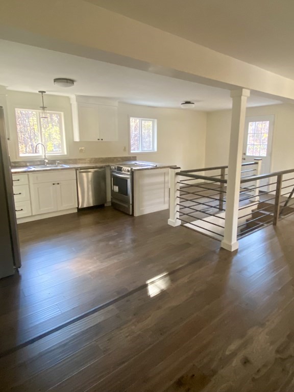 129 Greenwich Road Ware, MA 01082 - Photo 4 of 31 a view of a kitchen with a sink and dishwasher white cabinet with wooden floor