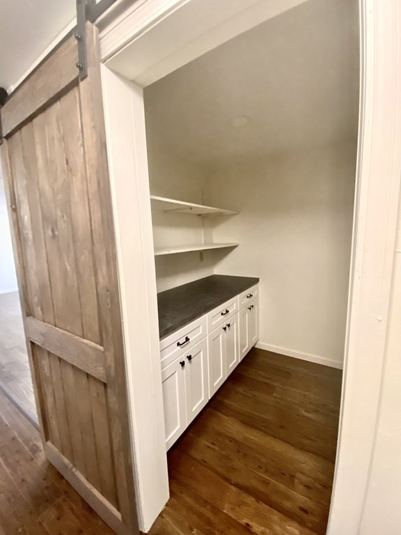 129 Greenwich Road Ware, MA 01082 - Photo 8 of 31 a kitchen with white cabinets and a wooden floor