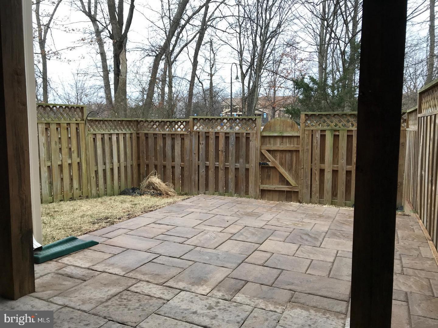 21927 Windy Oaks Square Broadlands, VA 20148 - Photo 13 of 18 a view of wooden fence and trees around