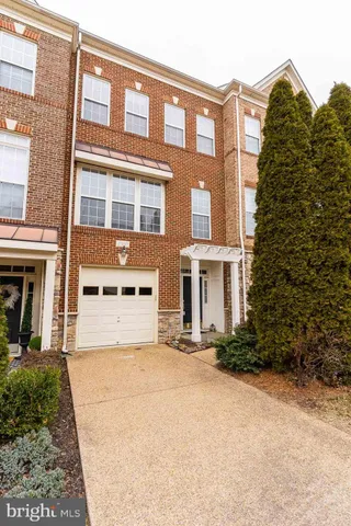 a front view of a building with many windows