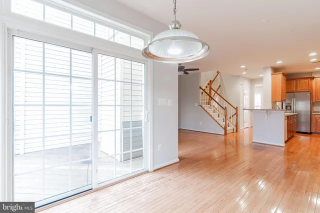 a balcony with wooden floor and fence