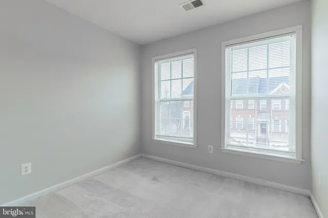 an empty room with closet area