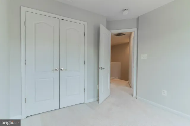a view of a bathroom from a hallway