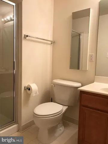 a bathroom with a toilet a sink and shower
