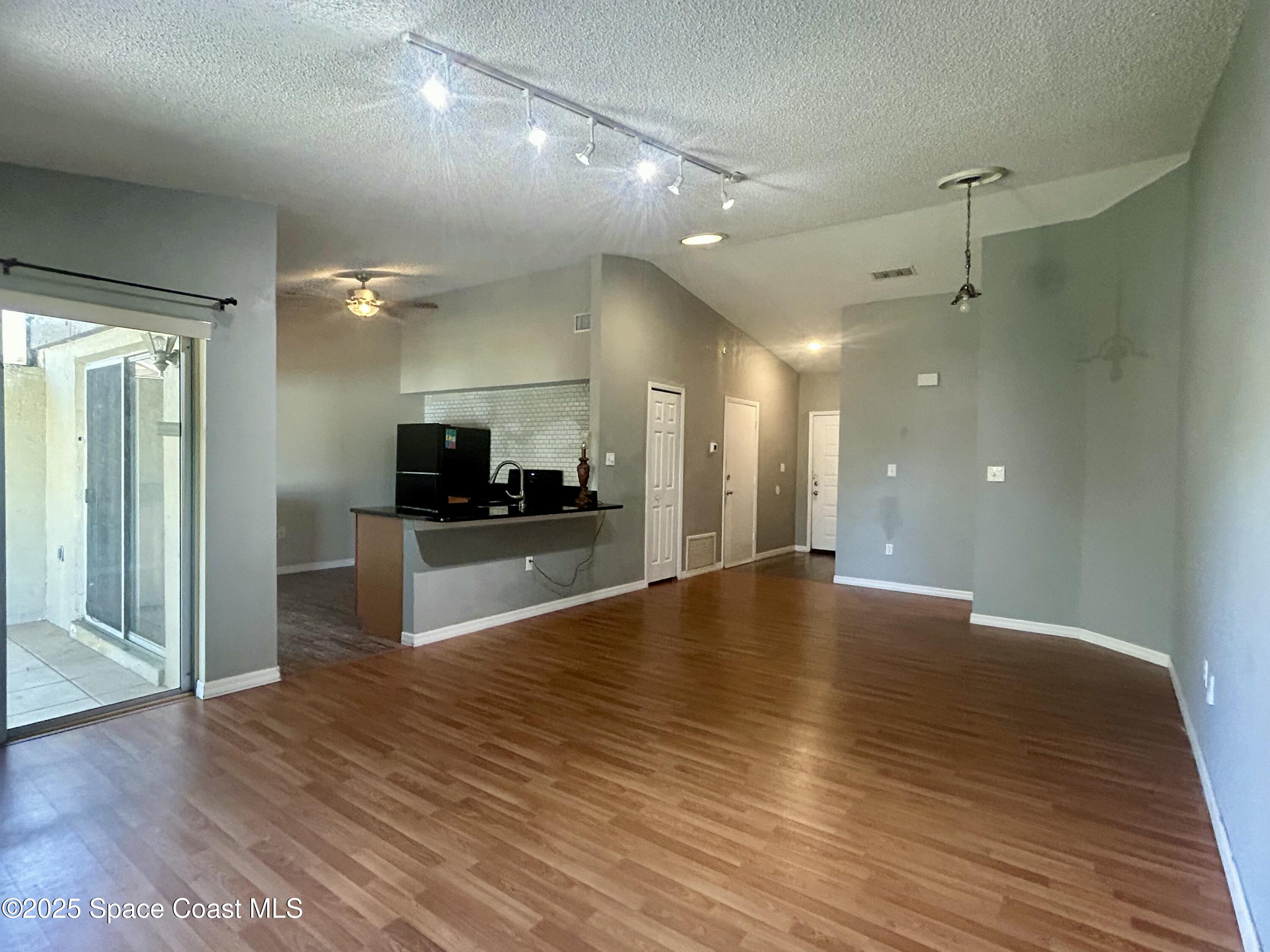 834 Barbados Avenue Melbourne, FL 32901 - Photo 3 of 12 a view of a kitchen with a sink and a large mirror