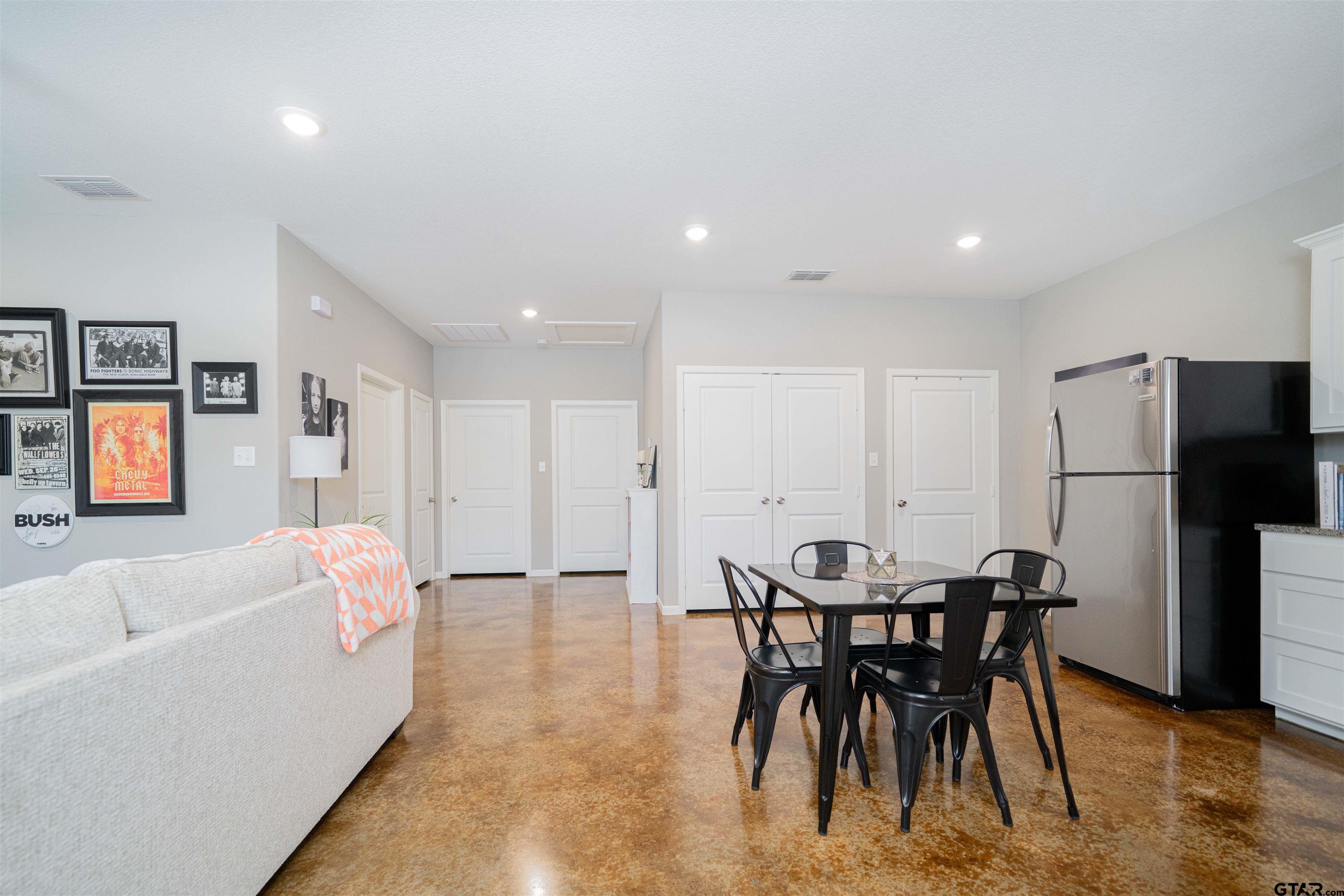 128 Loye Lane Hawkins, TX 75765 - Photo 13 of 25 a dining room with furniture and a kitchen view