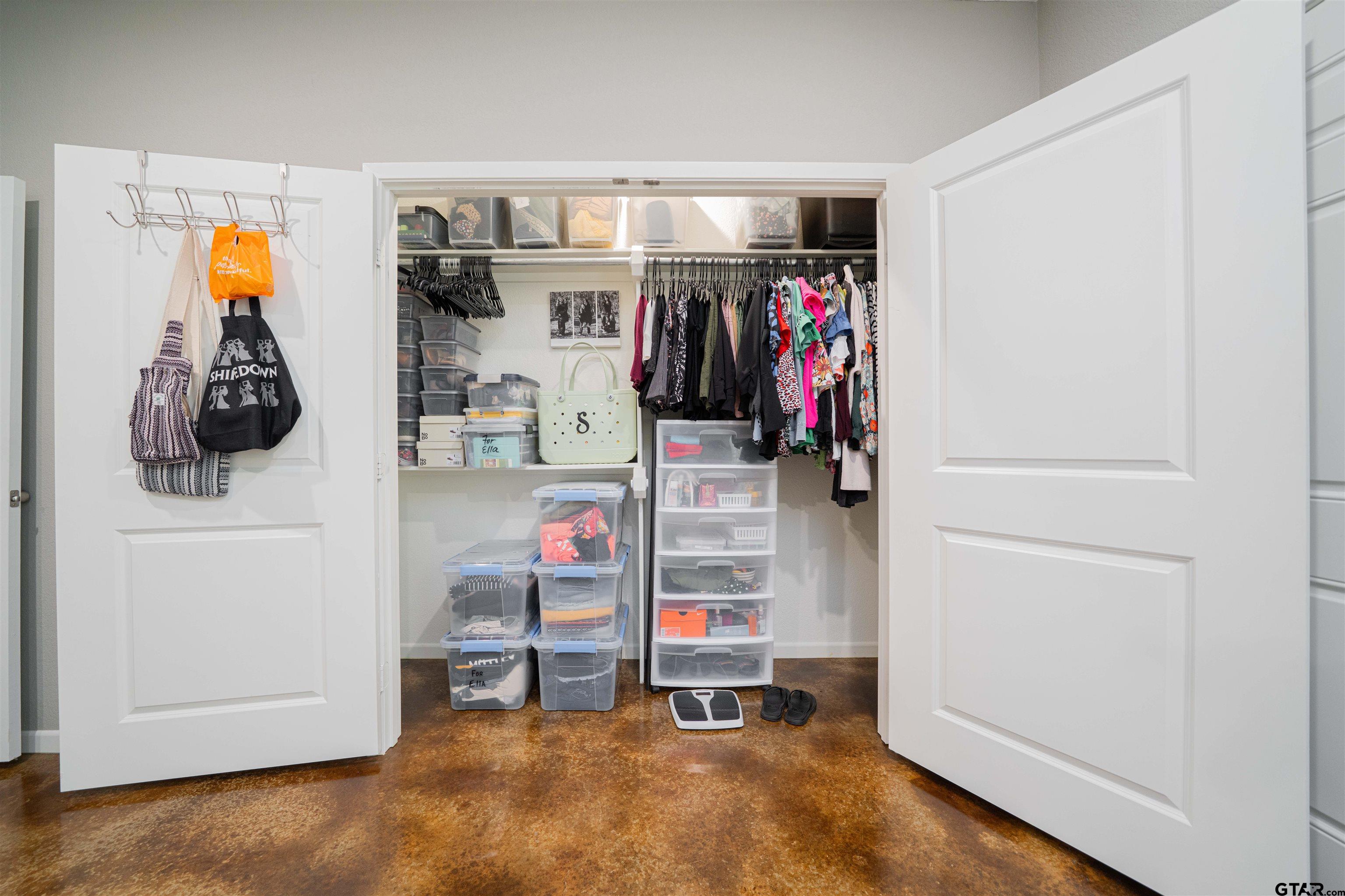 128 Loye Lane Hawkins, TX 75765 - Photo 18 of 25 a view of walk in closet with clothes and shoes