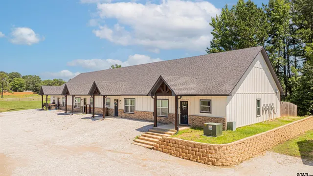 a view of house and outdoor space with swimming pool and furniture