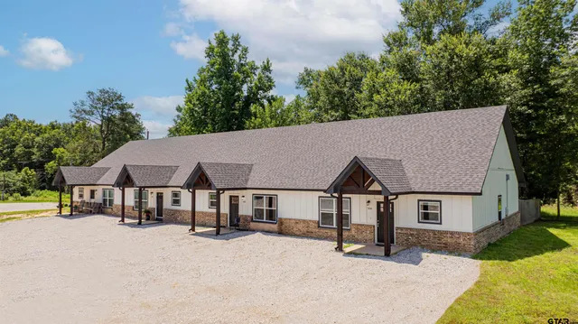 a house with trees in the background