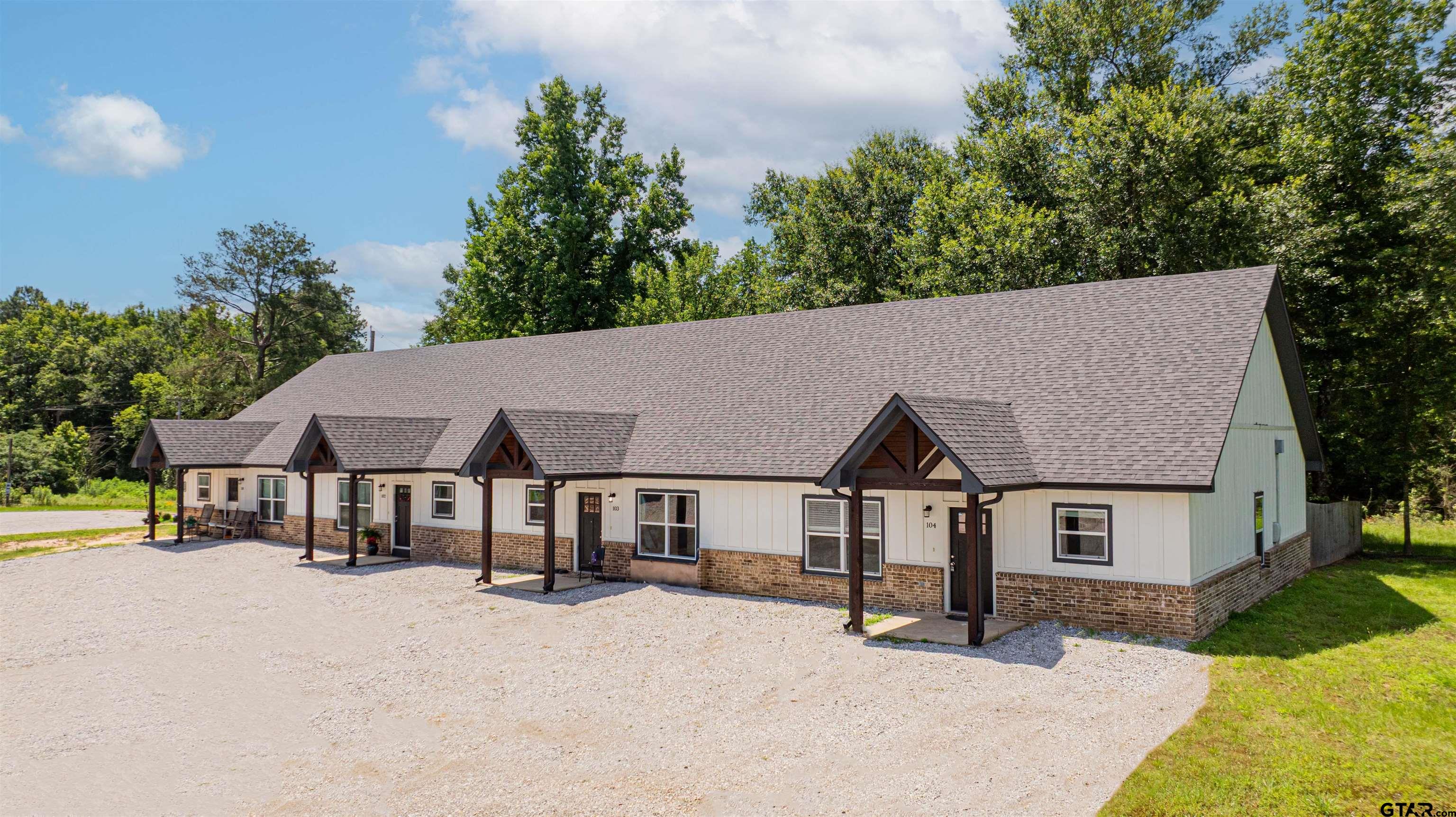 128 Loye Lane Hawkins, TX 75765 - Photo 4 of 25 a house with trees in the background