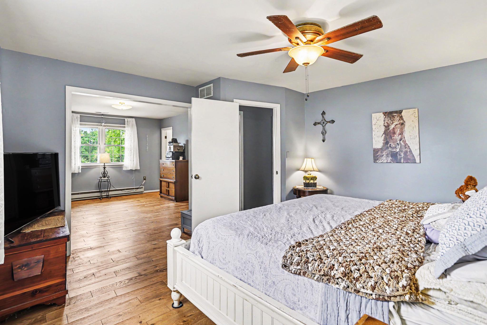2226 Harney Road Littlestown, PA 17340 - Photo 8 of 40 a bed room with a bed and a television