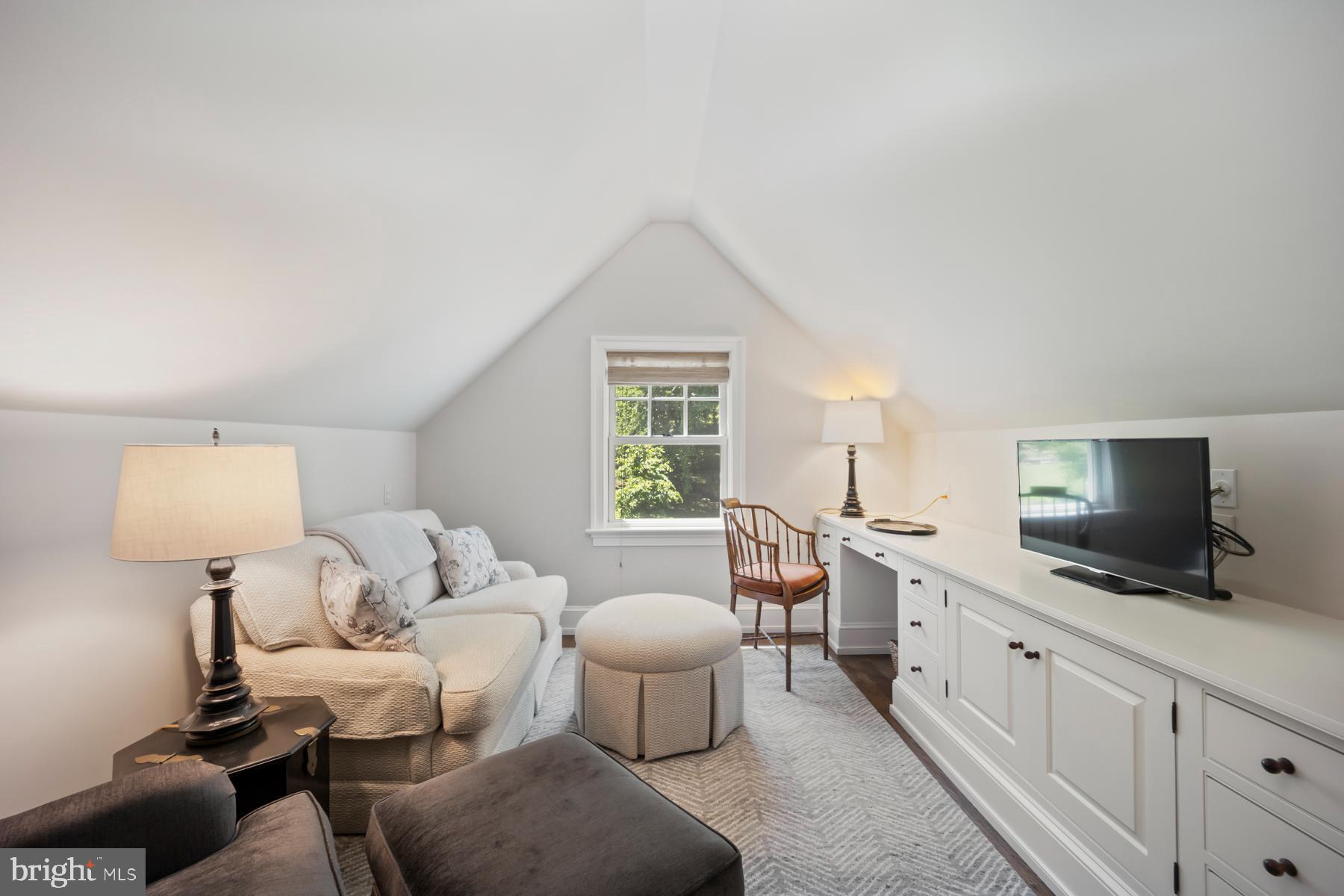 1660 Mt Pleasant Road Villanova, PA 19085 - Photo 23 of 43 a living room with furniture a window and a flat screen tv