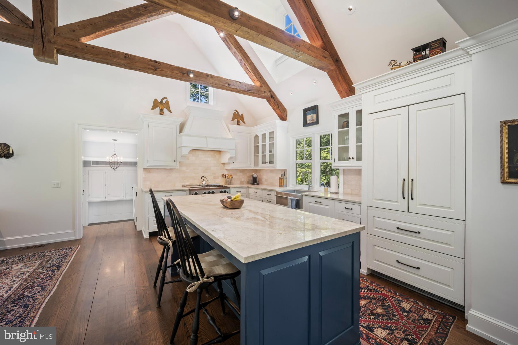 1660 Mt Pleasant Road Villanova, PA 19085 - Photo 6 of 43 a open kitchen with a table and chairs in it