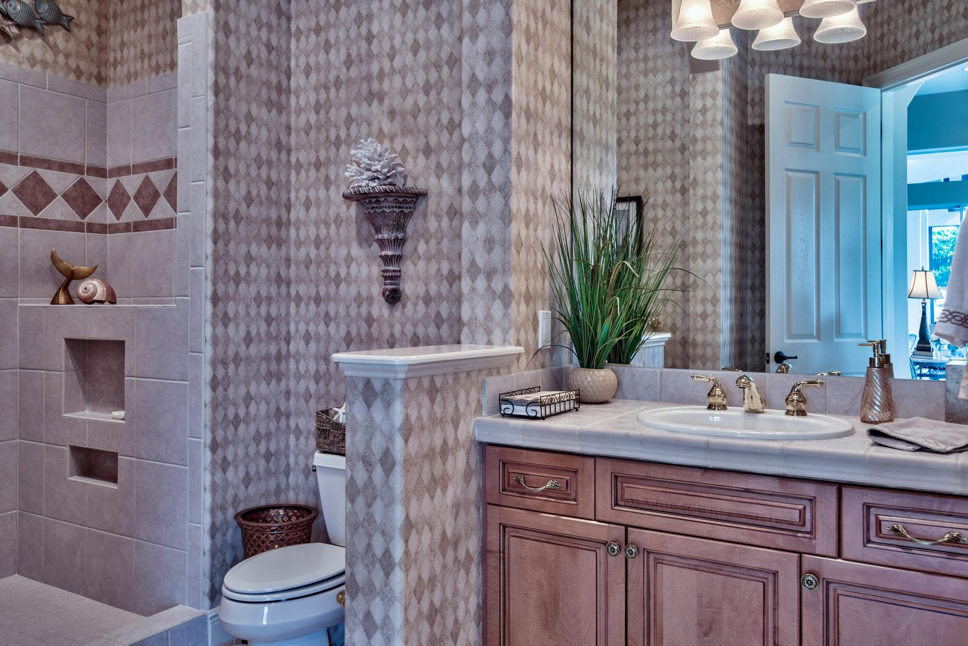 2956 Pine Valley Road Miramar Beach, FL 32550 - Photo 29 of 69 a bathroom with a sink a toilet and shower
