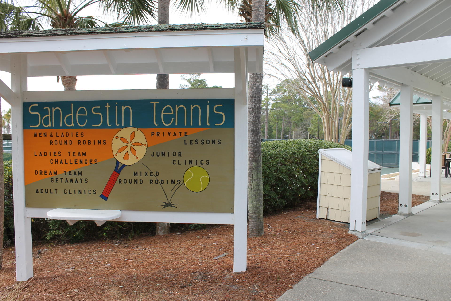 2956 Pine Valley Road Miramar Beach, FL 32550 - Photo 56 of 69 a sign on the side of a building