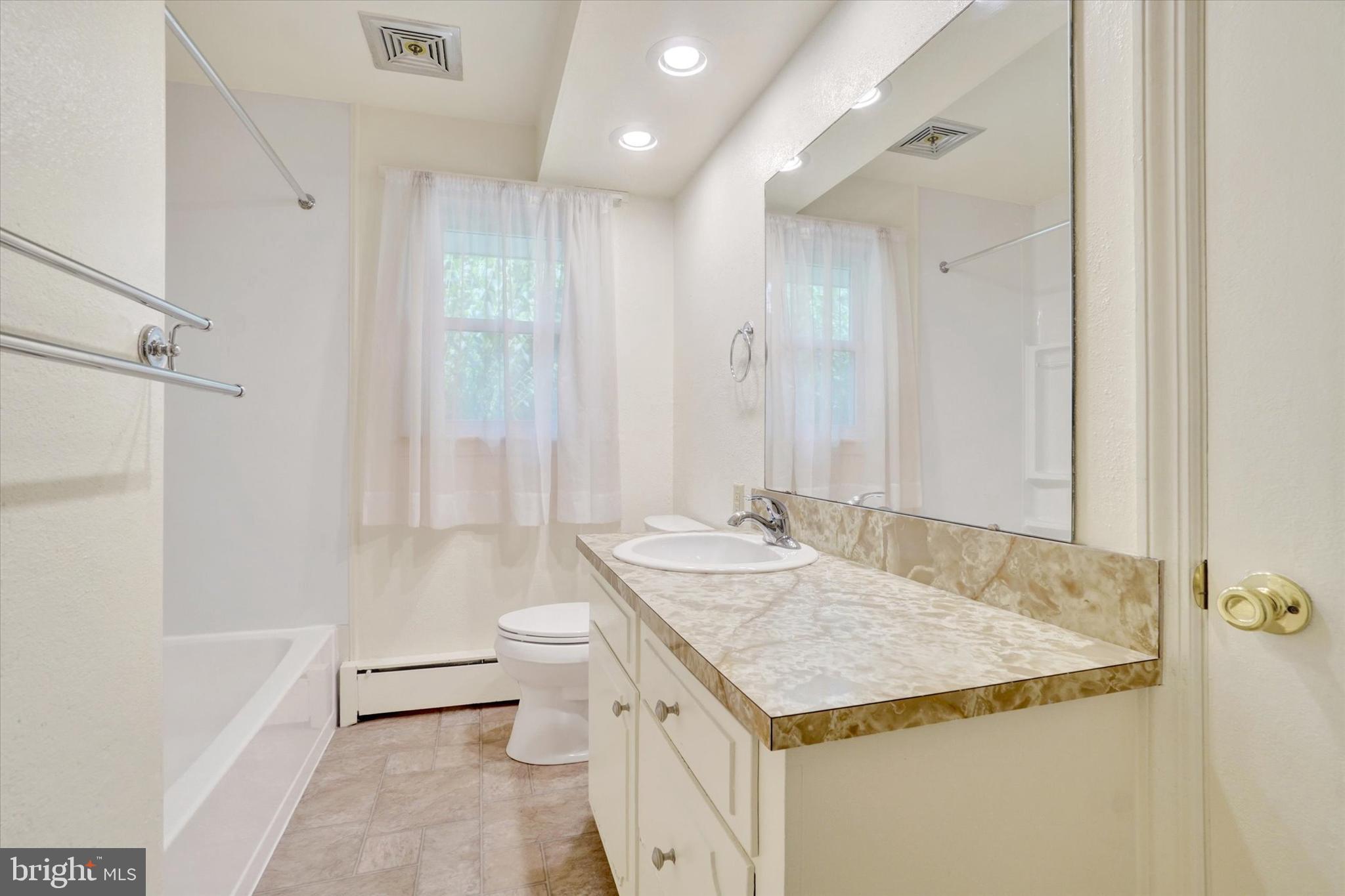 823 Glendale Road York, PA 17403 - Photo 24 of 33 a bathroom with a granite countertop sink and a mirror