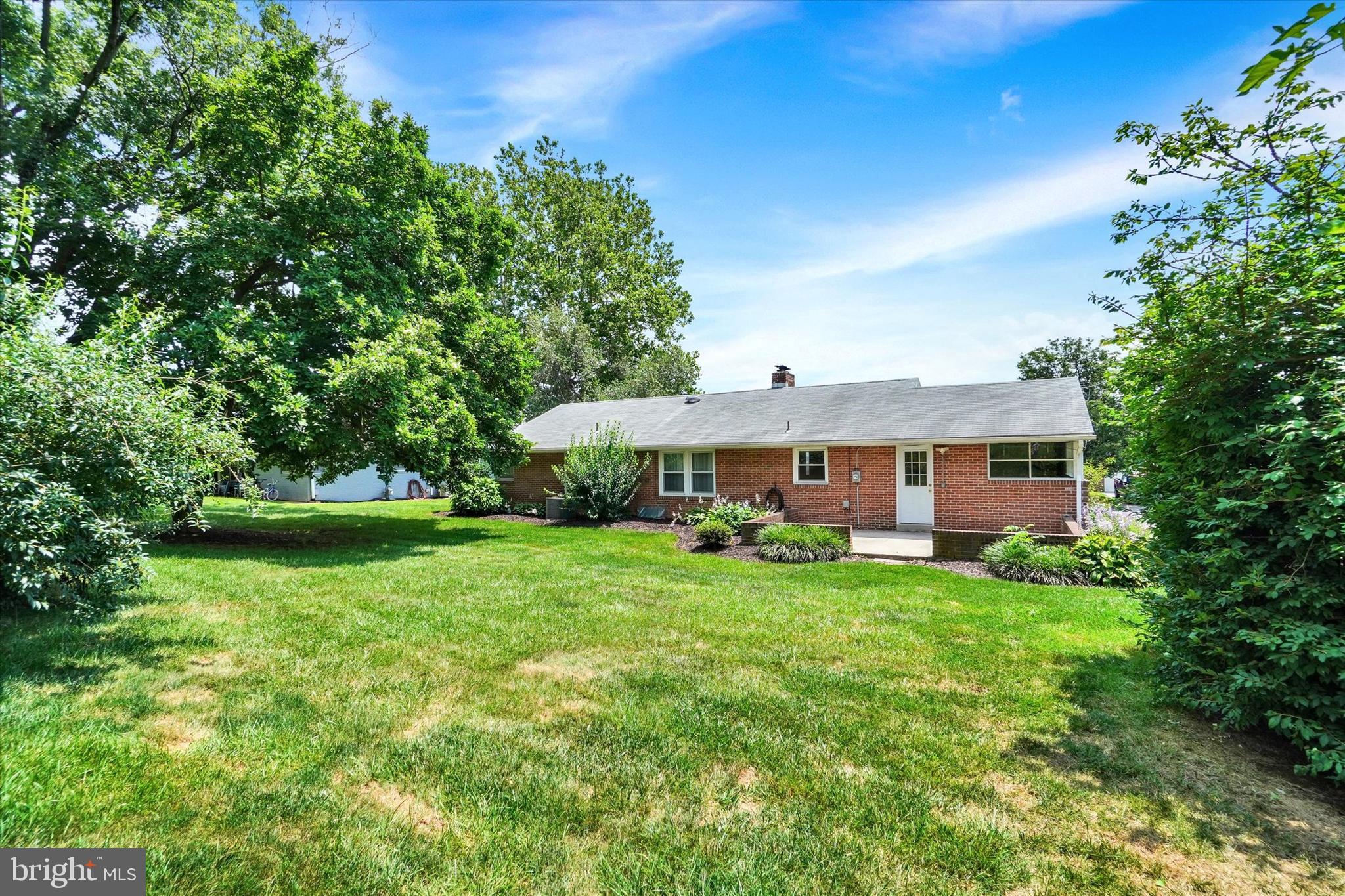 823 Glendale Road York, PA 17403 - Photo 30 of 33 a view of a house with a big yard potted plants and large tree