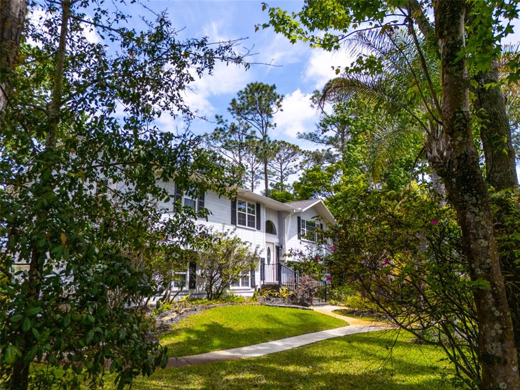 a view of a house with a yard