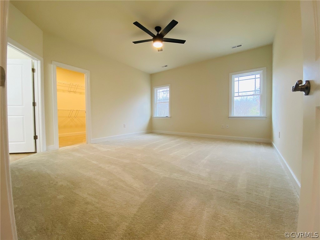 445 New S Ridge Road Bumpass, VA 23024 - Photo 13 of 38 an empty room with a ceiling fan and window