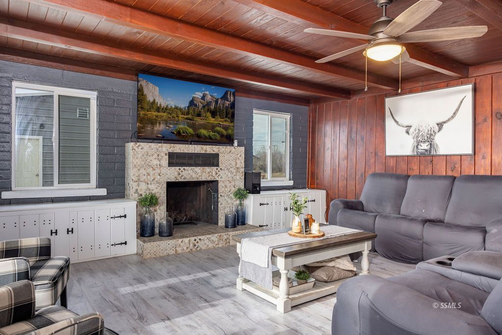 134 South Sierra View Street Ridgecrest, CA 93555 - Photo 7 of 43 a living room with furniture a window and a fireplace