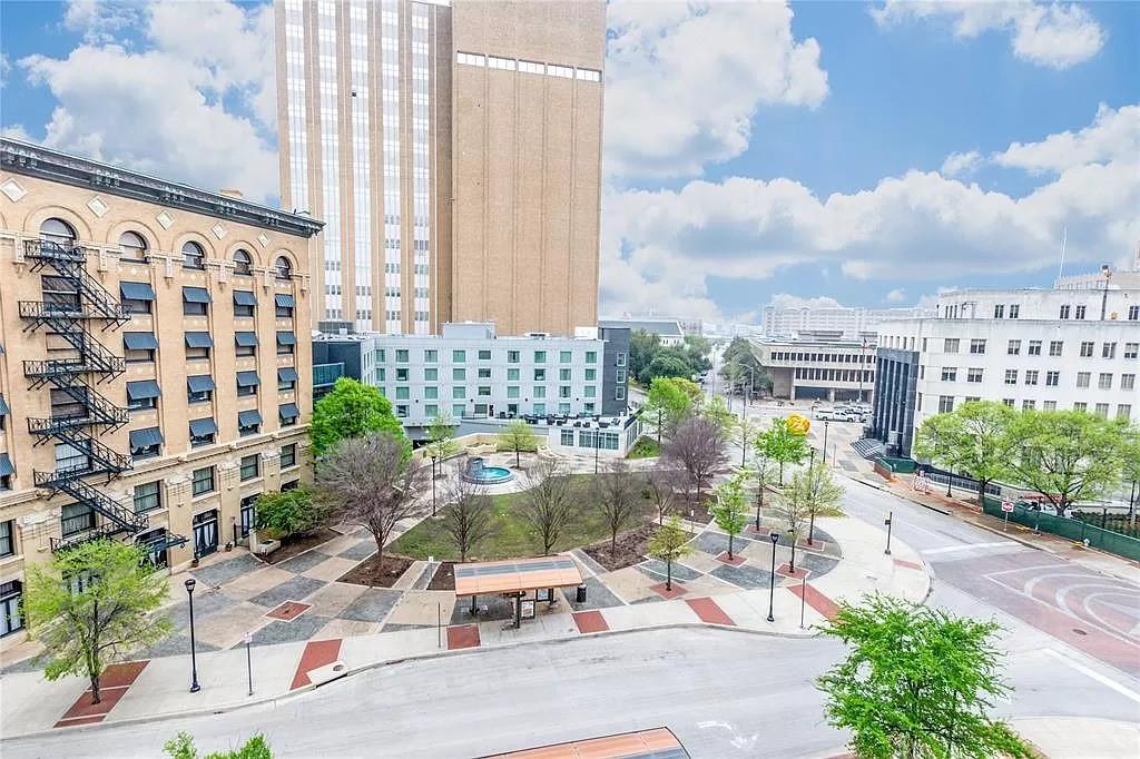 910 Houston Street, Unit 604 Fort Worth, TX 76102 - Photo 4 of 14 View of building exterior featuring a city view