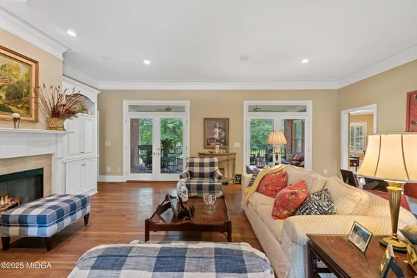 a living room with fireplace furniture and a flat screen tv