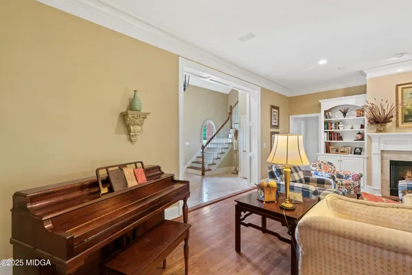 a living room with a fireplace and a window