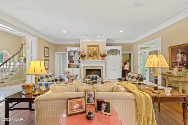 a view of a dining room with furniture and chandelier