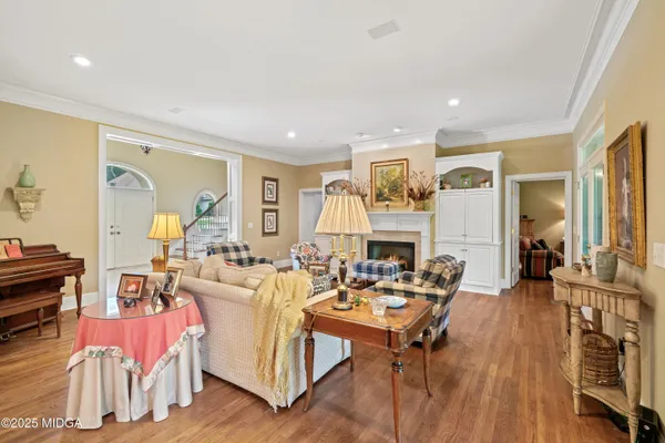 a view of a dining room with furniture and wooden floor