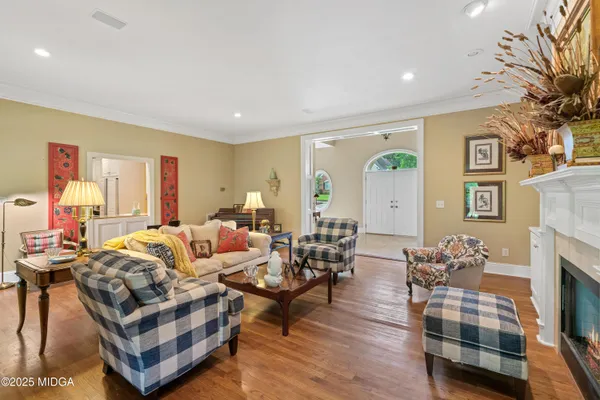 a view of a dining room with furniture and wooden floor