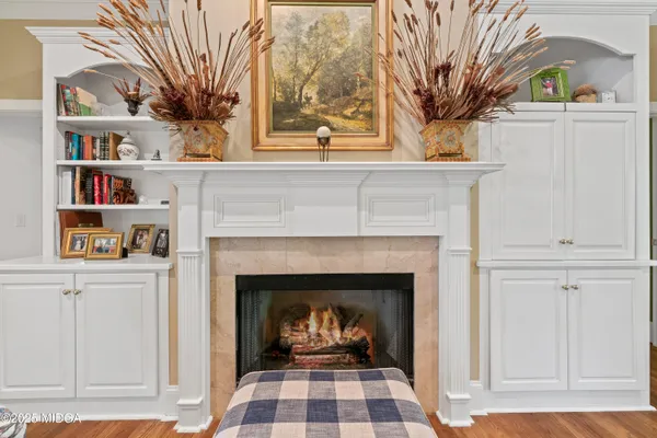 a kitchen with a sink stove and white cabinets