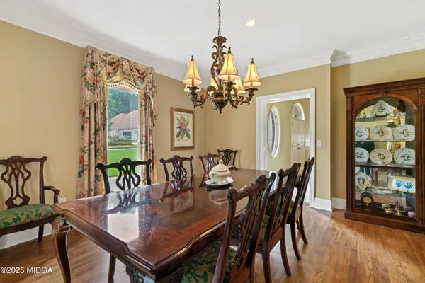 a living room with kitchen island furniture and a flat screen tv