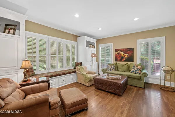 a bath tub sitting in a bathroom next to a window
