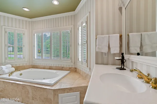 a room with a sink and cabinets