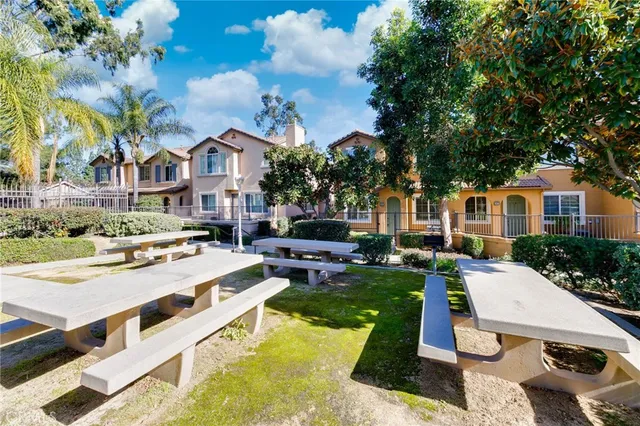 a view of a house with backyard porch and sitting area