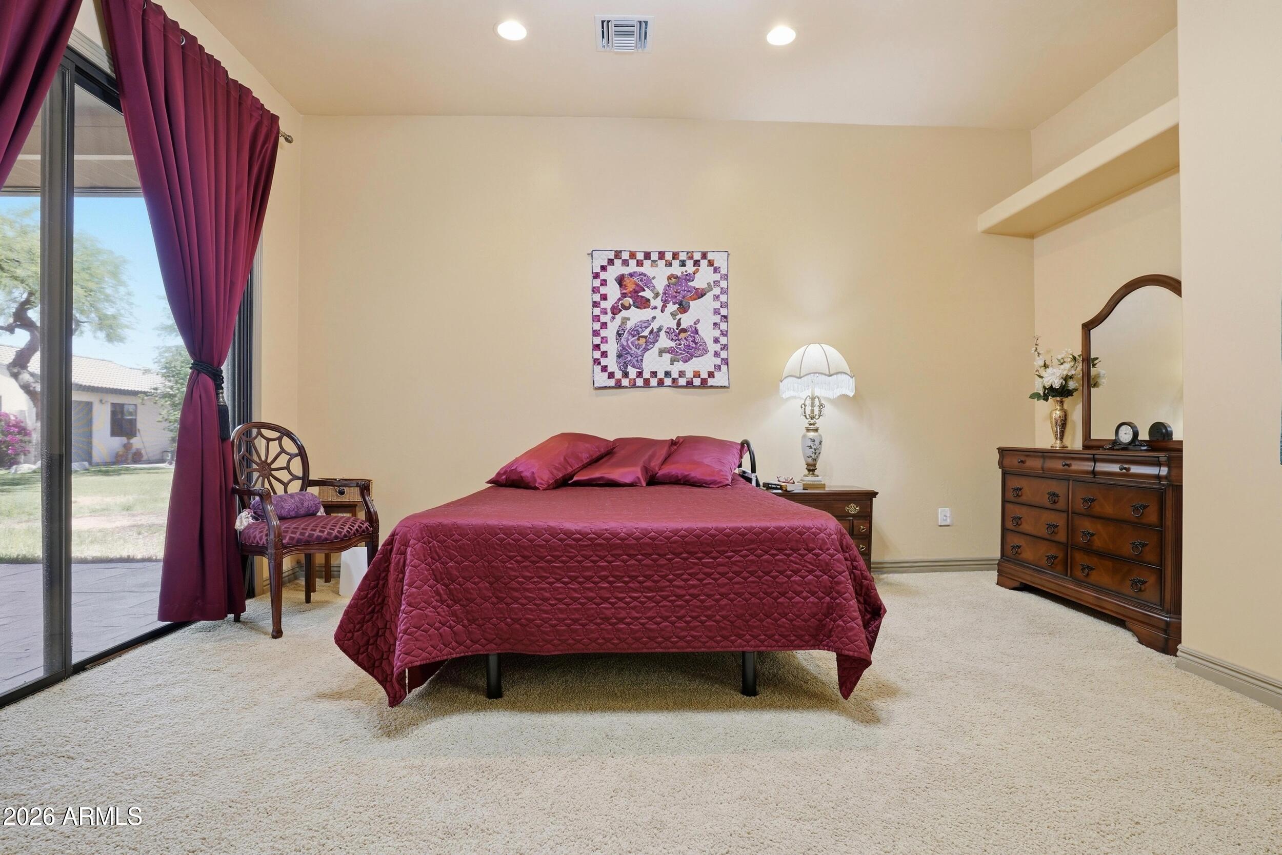 6334 East Albany Street Mesa, AZ 85205 - Photo 26 of 72 a bedroom with a bed and a dresser