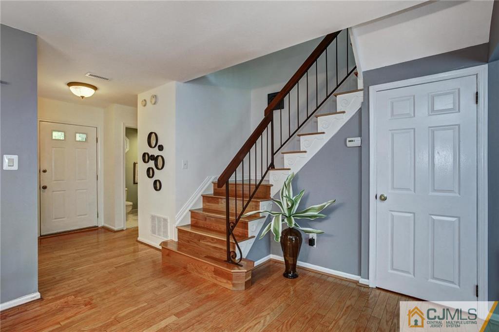1902 Timber Oaks Road Edison, NJ 08820 - Photo 12 of 22 a view of entryway with wooden floor and stairs