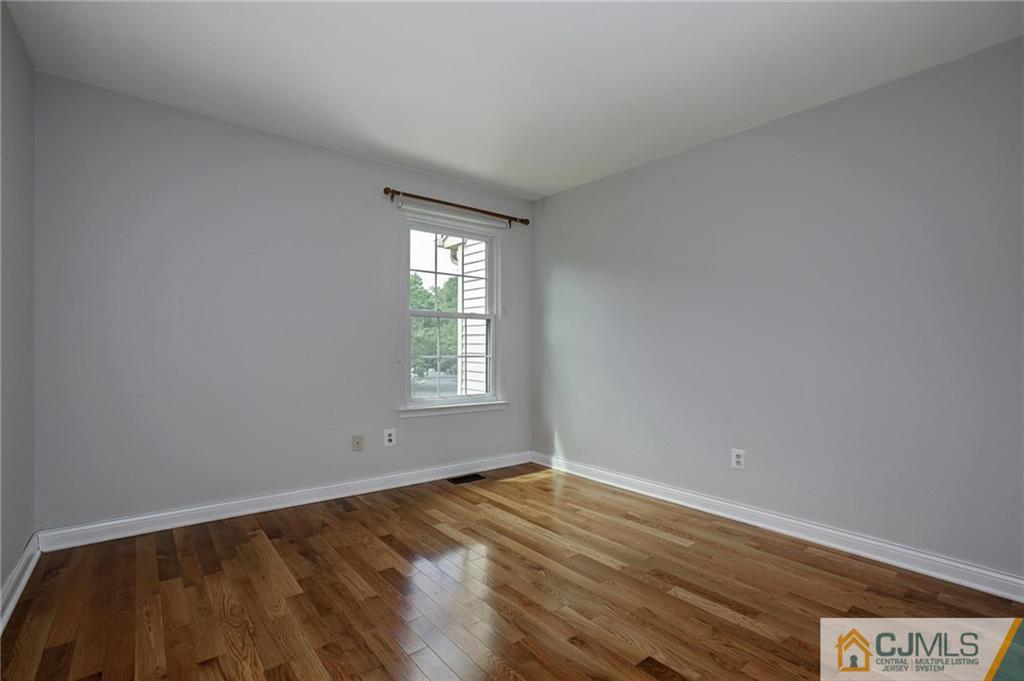1902 Timber Oaks Road Edison, NJ 08820 - Photo 18 of 22 wooden floor in an empty room