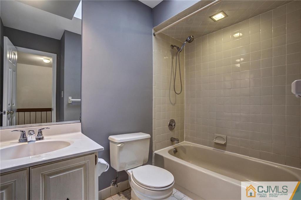 1902 Timber Oaks Road Edison, NJ 08820 - Photo 20 of 22 a bathroom with a toilet a sink and bathtub