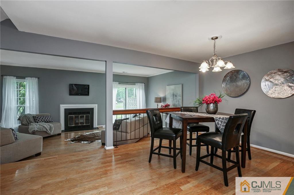 1902 Timber Oaks Road Edison, NJ 08820 - Photo 3 of 22 a view of a dining room with furniture and wooden floor