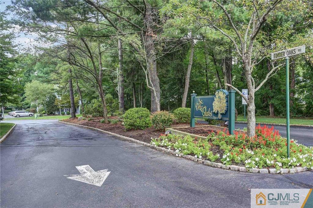 1902 Timber Oaks Road Edison, NJ 08820 - Photo 22 of 22 a view of a street with potted plants and large trees