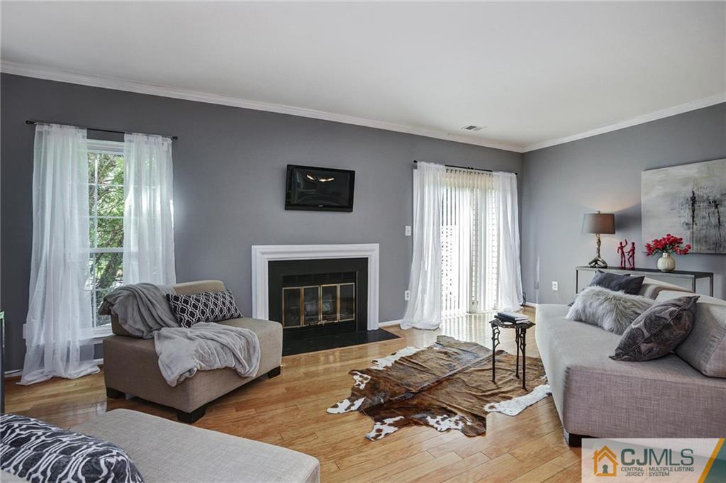 1902 Timber Oaks Road Edison, NJ 08820 - Photo 5 of 22 a living room with furniture and a fireplace