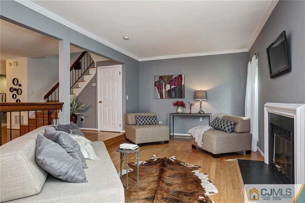 1902 Timber Oaks Road Edison, NJ 08820 - Photo 6 of 22 a living room with furniture and a flat screen tv