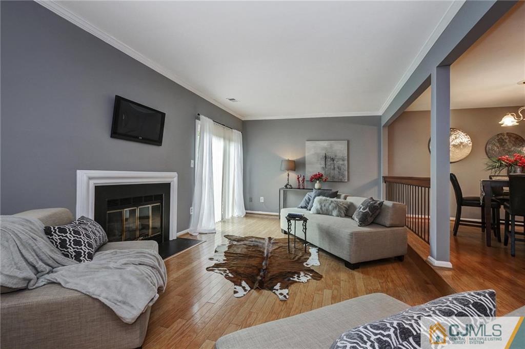 1902 Timber Oaks Road Edison, NJ 08820 - Photo 7 of 22 a living room with furniture and a fireplace