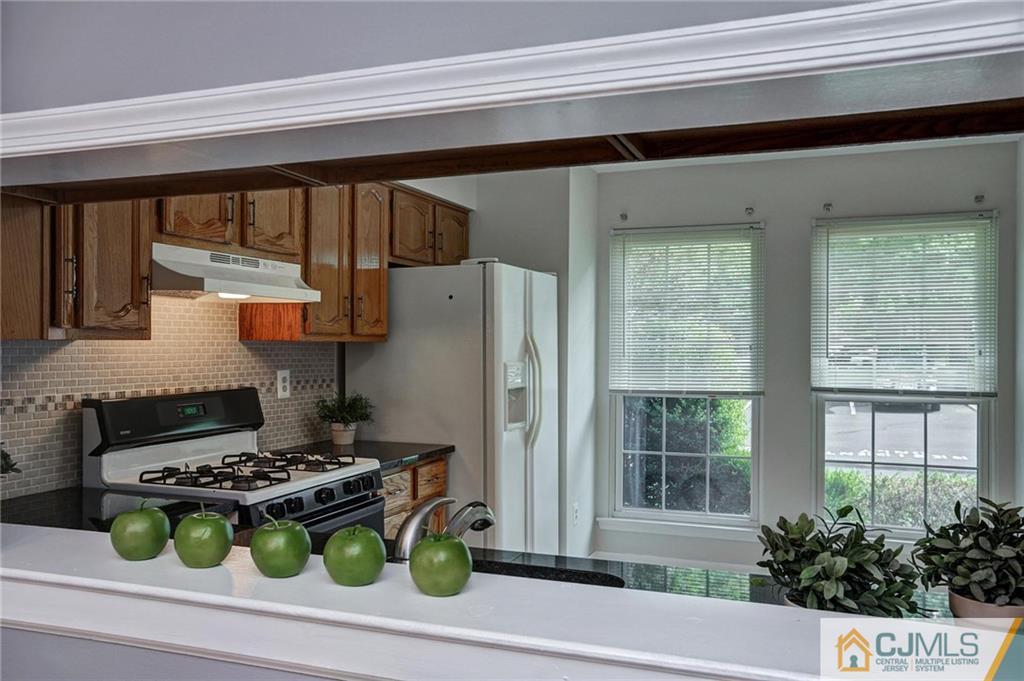 1902 Timber Oaks Road Edison, NJ 08820 - Photo 8 of 22 a white stove top oven sitting next to a window